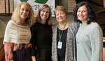 Business Team Collaborating At Crescendo Consulting Conference.