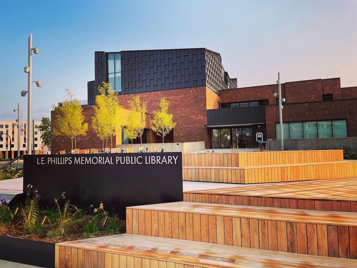 Modern Library Building Exterior, L.e. Phillips Memorial Public Library, With Colorful Landscaping And Contemporary Architectural Design.
