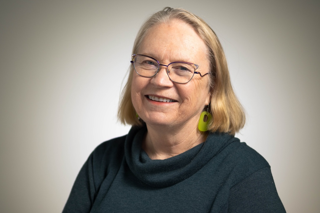 Professional Woman Smiling In Business Portrait For Crescendo Consulting Seo Images.