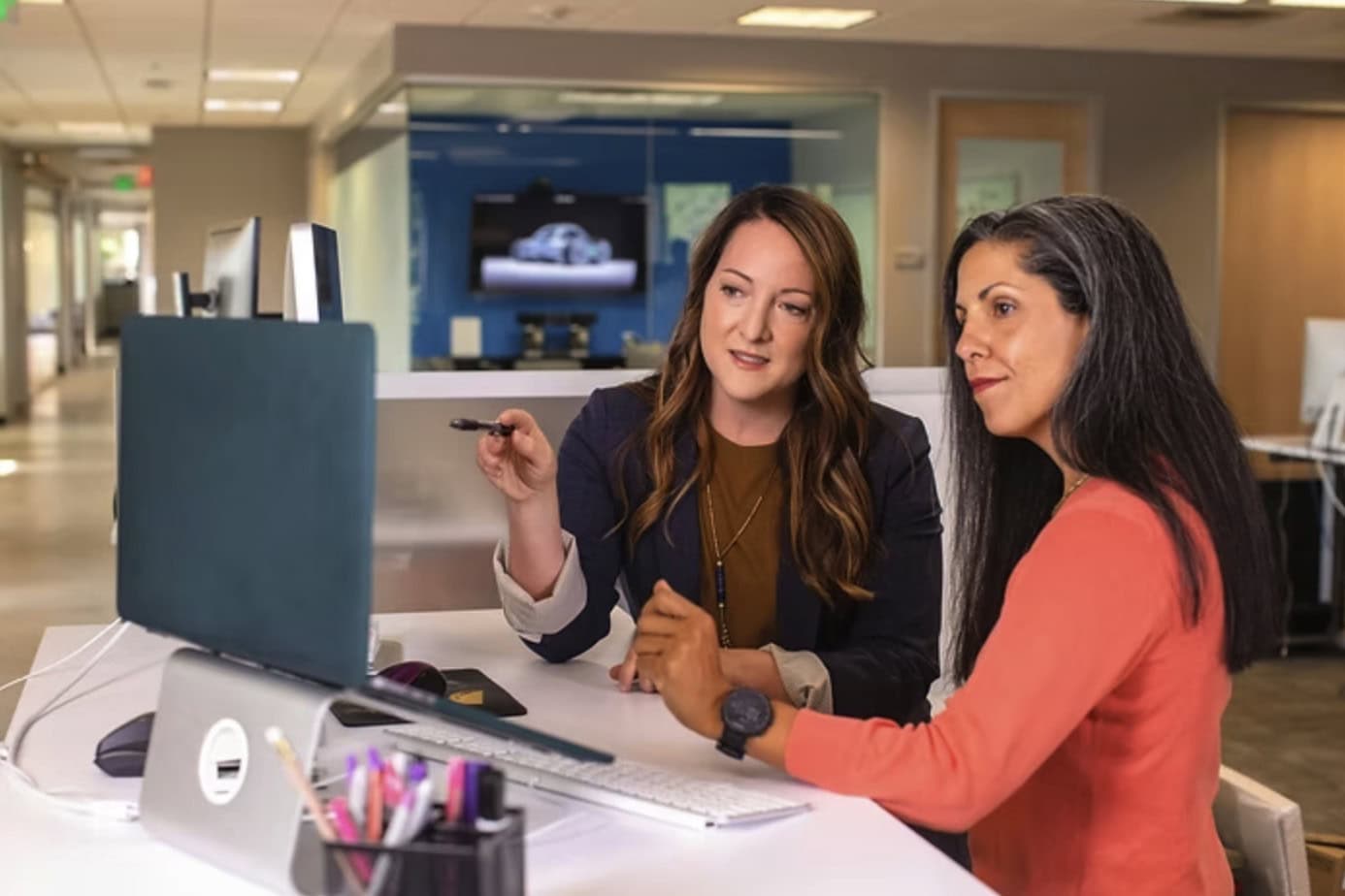 Consulting Professionals Collaborating At A Modern Office Desk For Business Strategy.