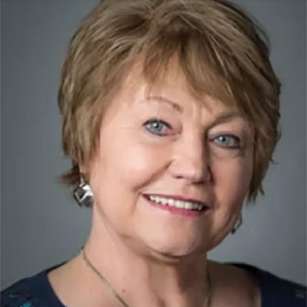 Professional Woman Smiling, Business Consulting, Leadership Coaching, Crescendo Consulting Logo In Background.